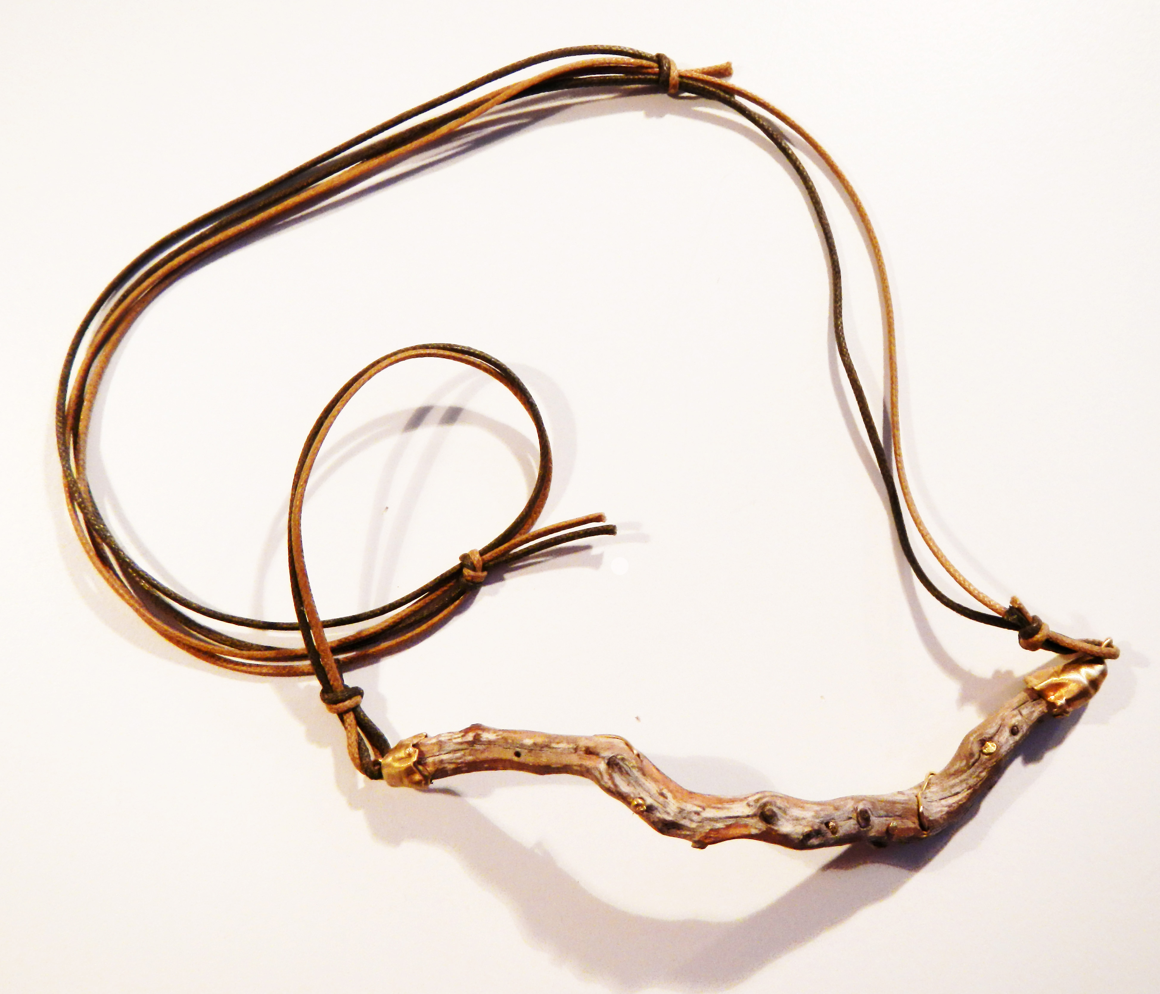 Twisted wood collected from beaches in Cyclades Islandes, painstakingly polished, become unique necklaces with gold 750 inserts ~ Rametto proveniente dalle Cicladi lavorato e reso unico con decorazioni e rifiniture in oro 750