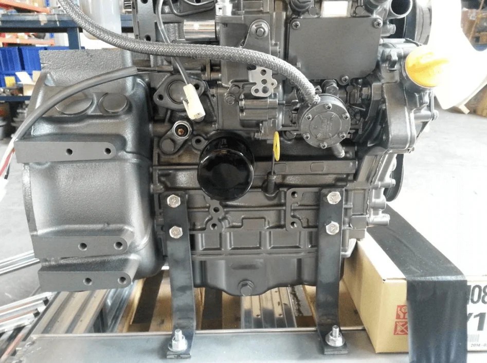 Yanmar diesel marine engine with PDF specs open on tablet