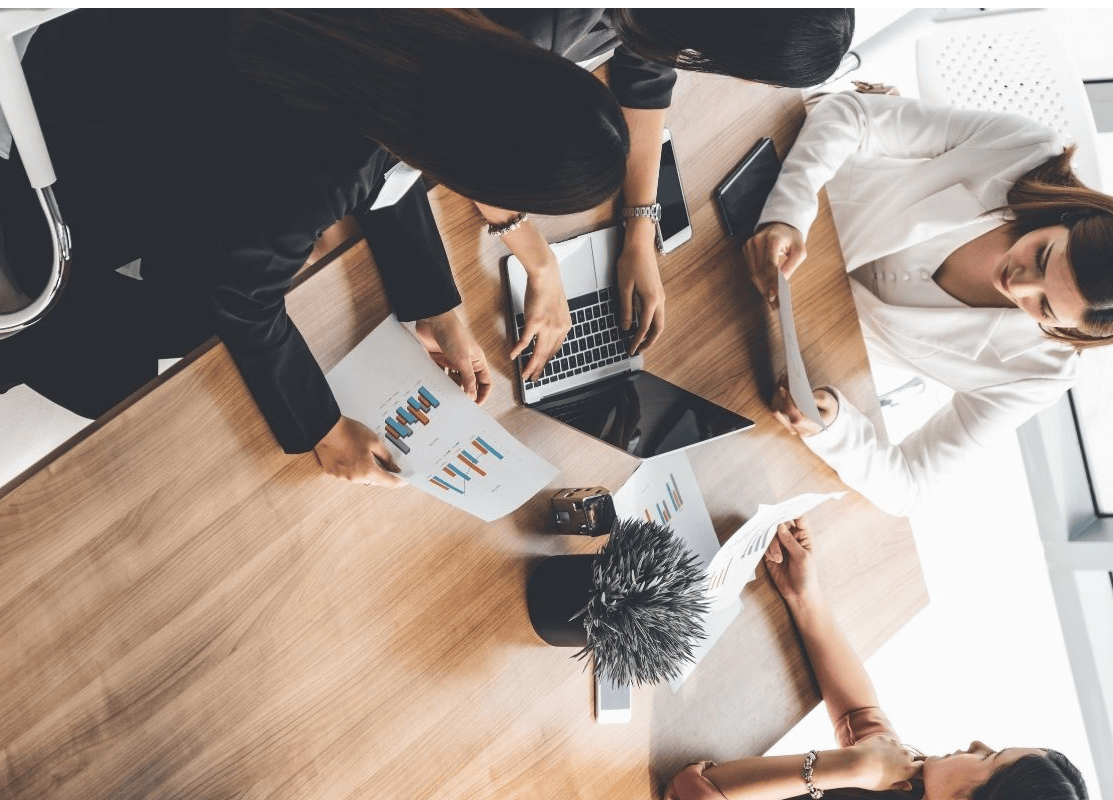 happy people working together at a table