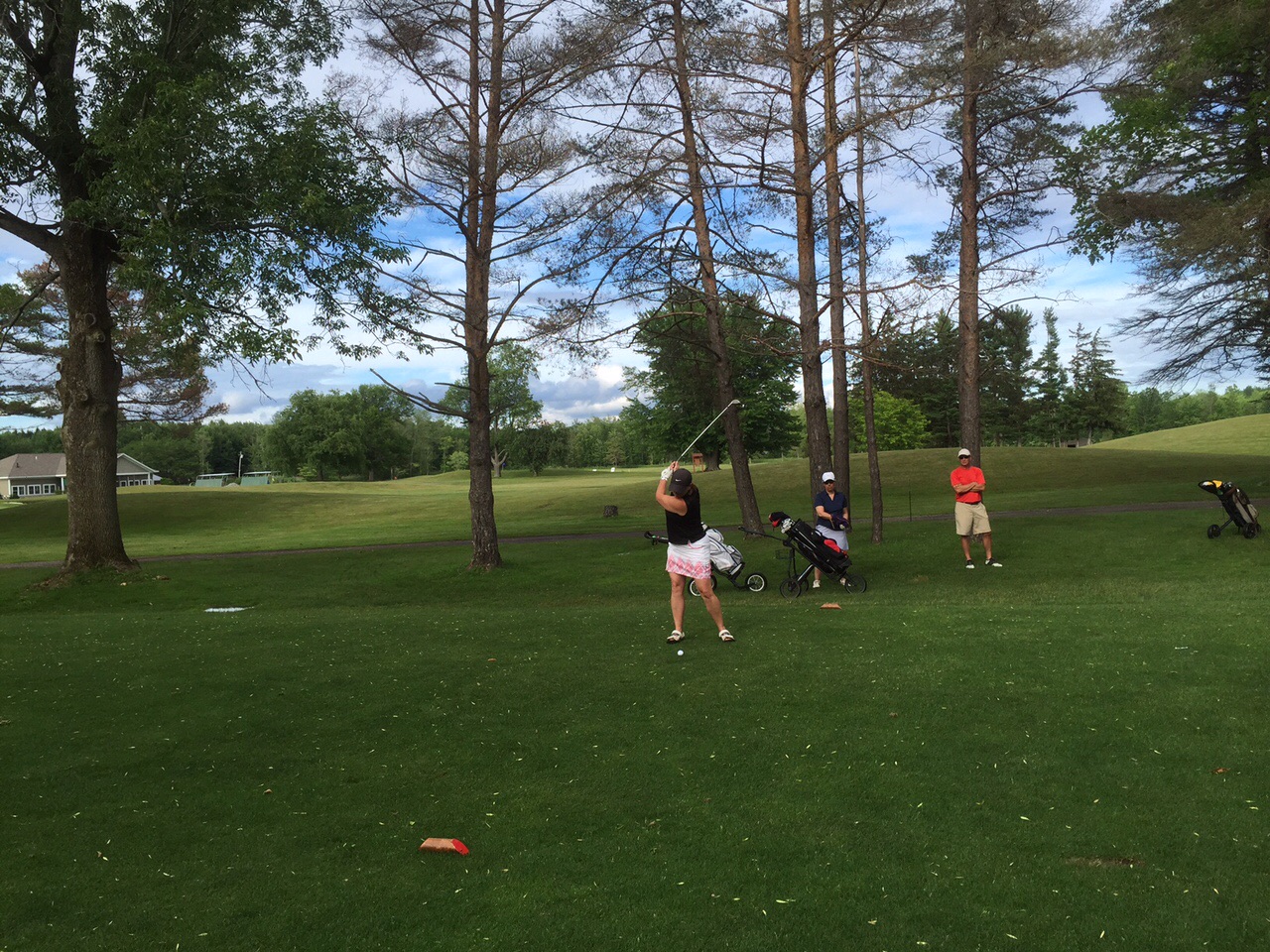 Amy drove it to the foot of the green.