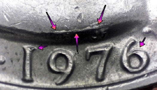 microscopic image of arrow noting a die crack error on the obverse of 1776 to 1976 american quarter