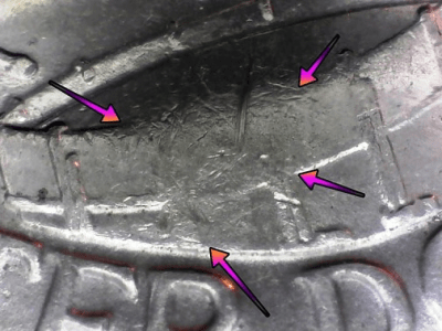 microscopic image a common error displaying in the center of the drum on the drummer boy quarter dollar coin