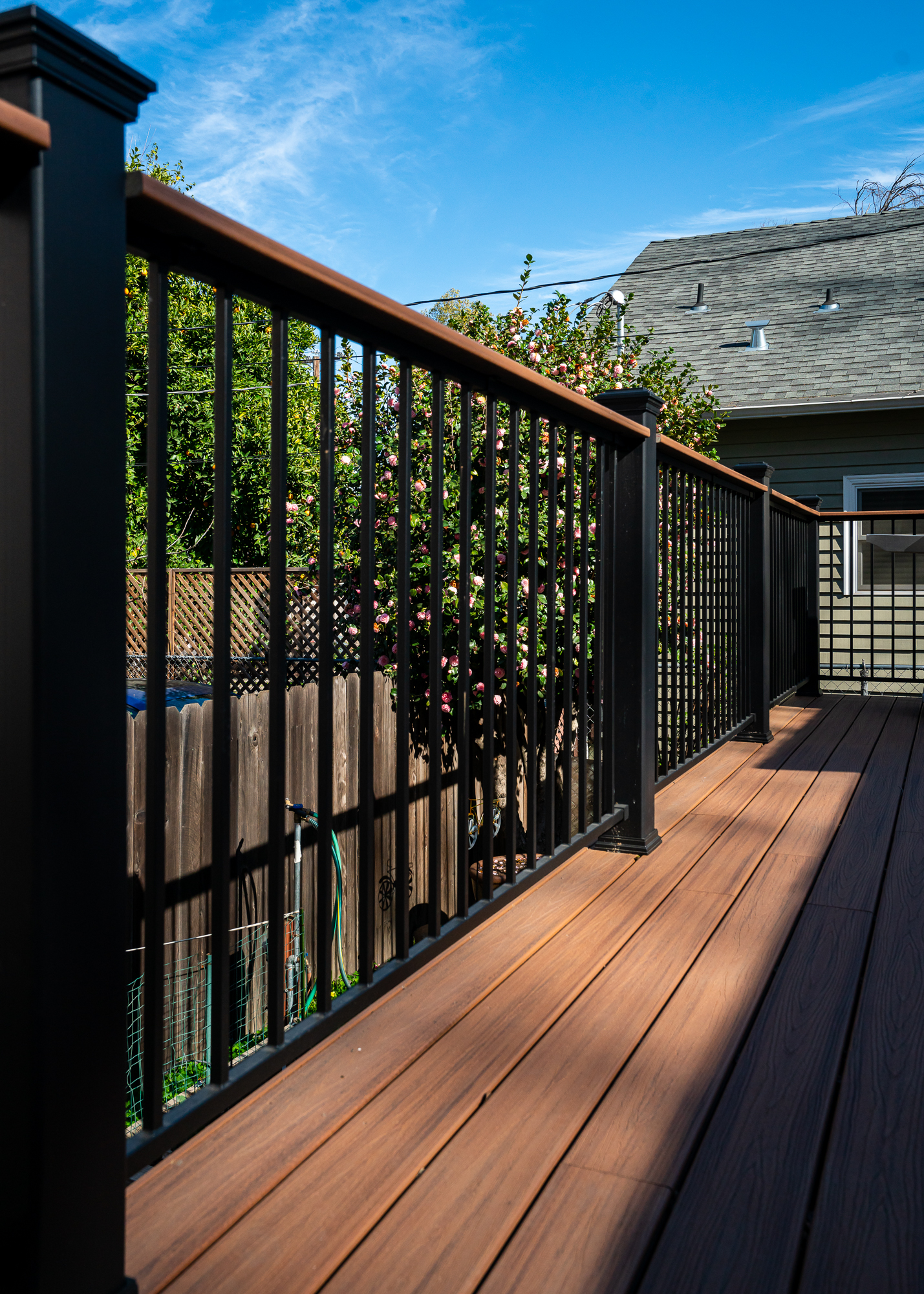 Metal railing and trex decking on a deck by Marksman Builders, Inc. in Sacramento, CA