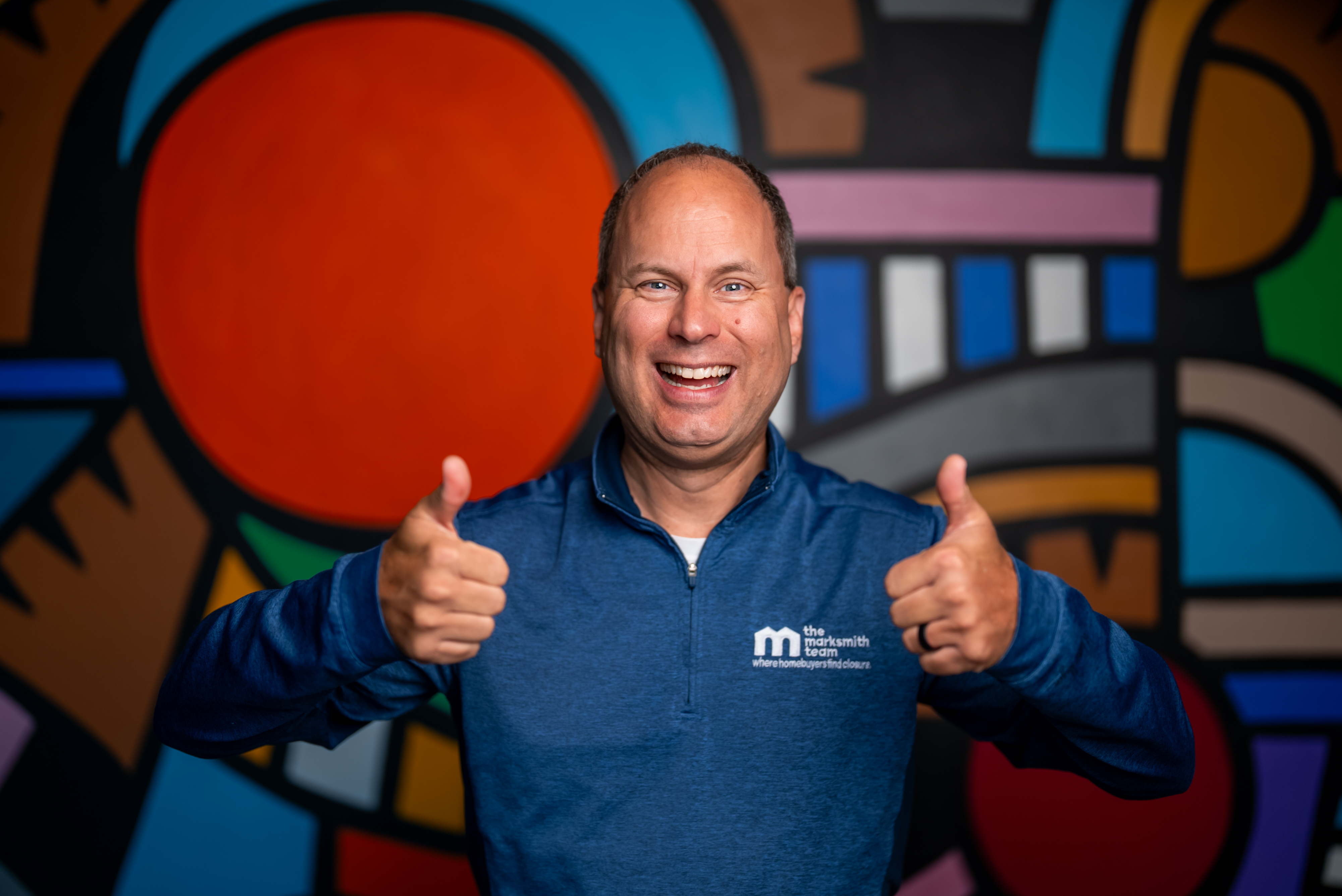 Mark Smith smiling and giving two thumbs up