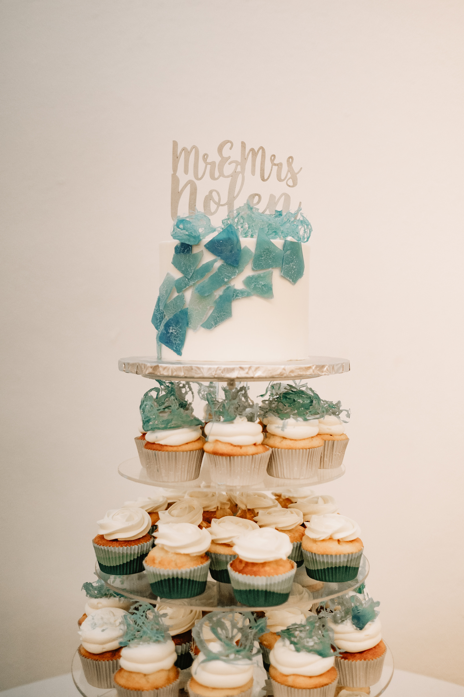 We love the way greenery. Coastal Clearwater Beach Wedding Cake Cupcake Tower With Sugar Sea Glass And Die Cut Name Cake Topper The Artistic Whisk Marry Me Tampa Bay Most Trusted Wedding Vendor Search