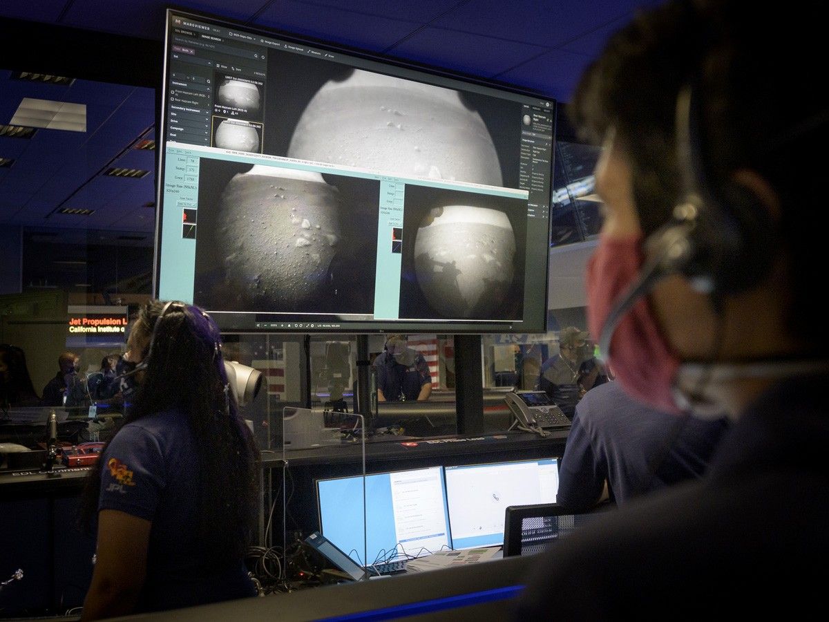 Mission control room with flight consoles and screens for spaceflight events