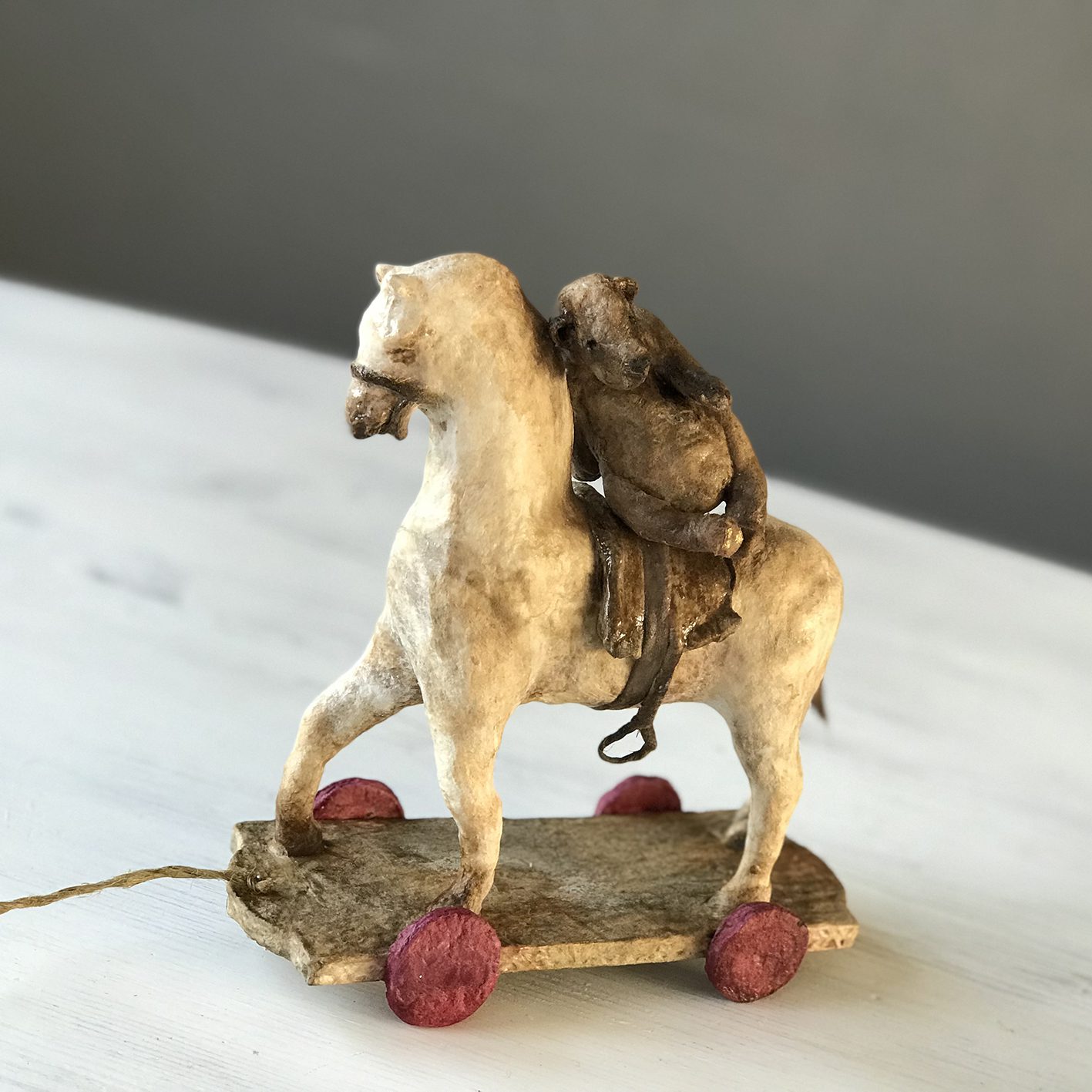 antique toy horse and teddy bear