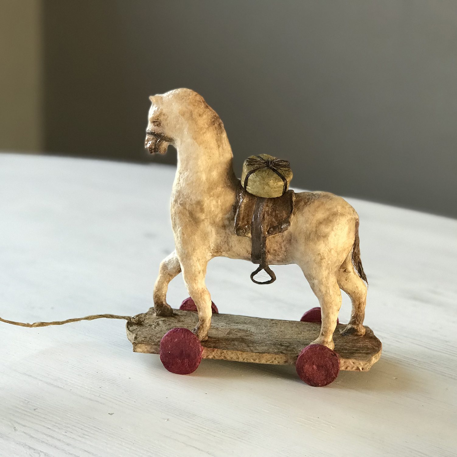 antique toy horse with a gift