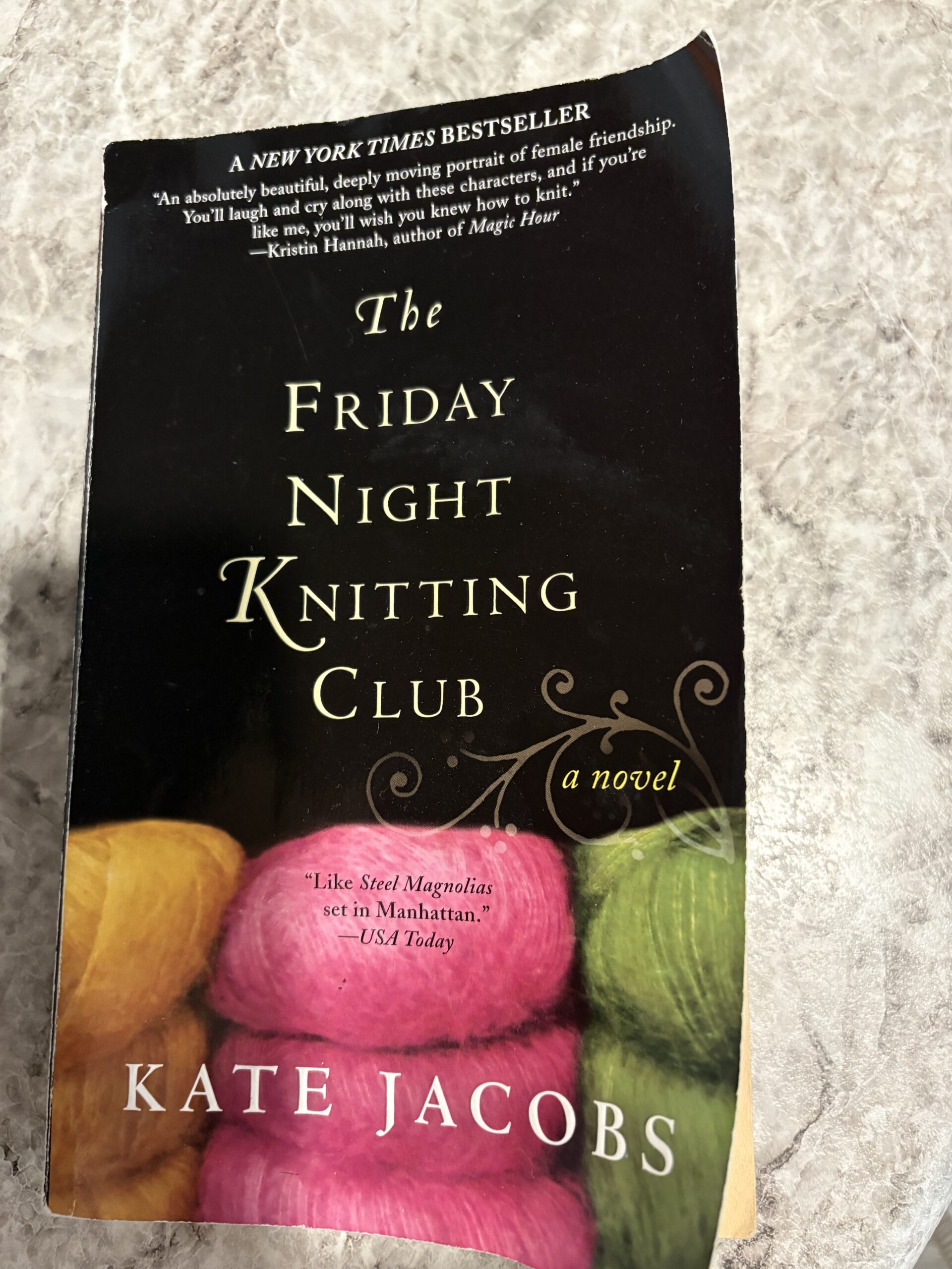 Book cover for 'The Friday Night Knitting Club' by Kate Jacobs, with NYT Bestseller praise at top and yarn imagery at bottom.