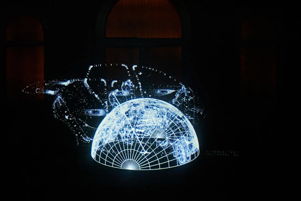 Visitors watching the short film in the 'Understanding' stage of Lexus's installation.