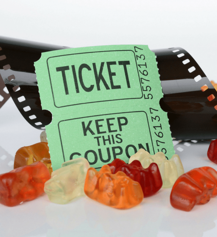 a couple tickets surrounded by gummy bears