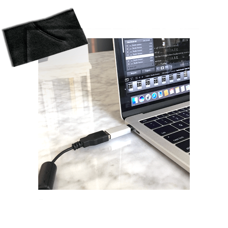 The tethering cable is connected to the computer.