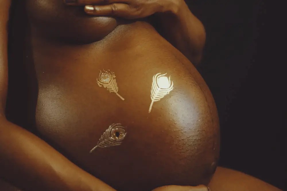 A pregnant woman getting ready for a custom massage in Minneapolis