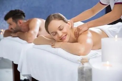 a couple receiving massage therapy