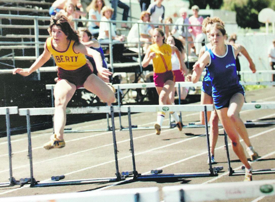 In 1979, Joy (far right) was in her usual position — leading a race for Acalanes High School.