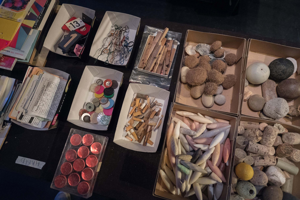 Various items from cigarette butts to stones collected in boxes