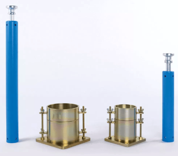 The image shows the standard proctor compaction test apparatus used to determine the relationship between soil moisture content and dry unit weight as described in ASTM D698 standard.