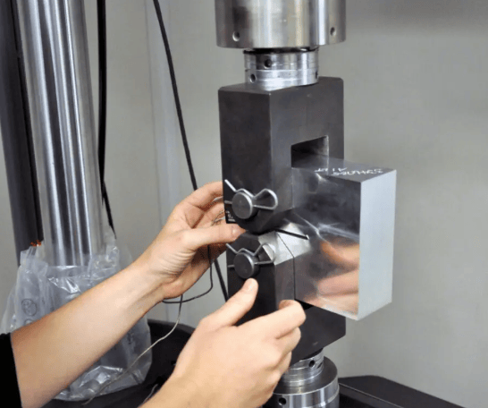 The image shows that the crack monitoring system measures crack length growth during ASTM E647 testing.