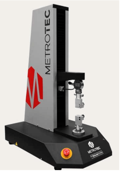 The image shows a universal testing machine that is used to evaluate the shear strength of an adhesive bond using a pin-and-collar specimen according to ASTM D4562.