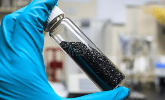 Image showing a test sample, which is a black solid in a granular form of activated carbon, for iodine number determination as described in ASTM D4607 standard.