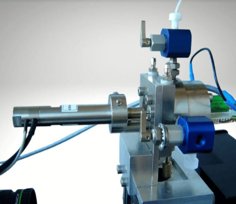 This image depicts a ceramic sample within a laboratory dilatometer for ASTM C372 linear thermal expansion testing.