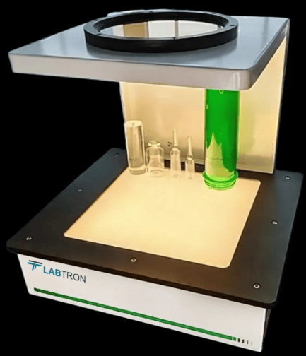 The image shows a laboratory polarized light stress measurement system with a loading fixture used to determine the optical stress coefficient of glass according to ASTM C770.