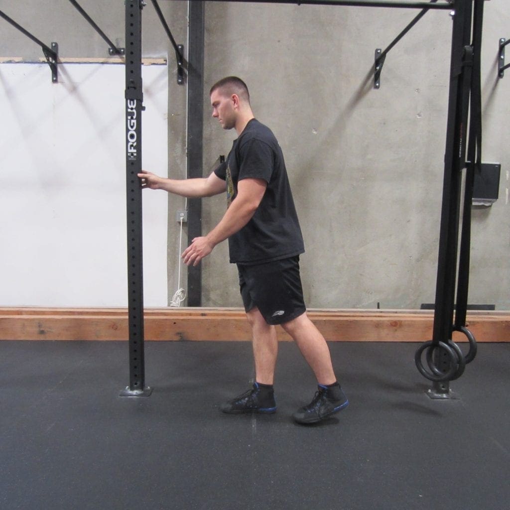 Hamstring activation squat warm up exercise 1