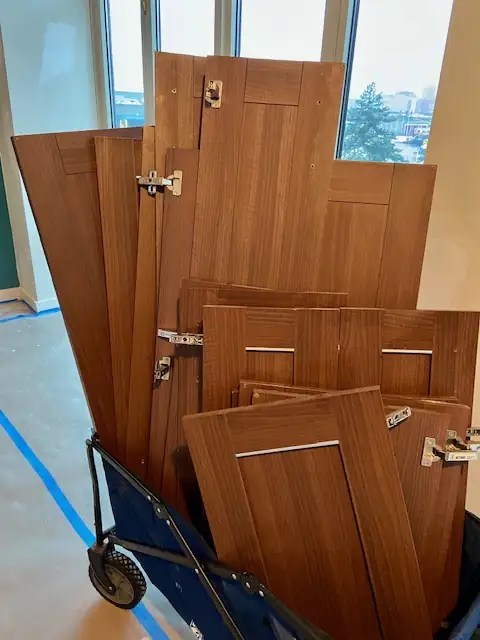 Cart of removed cabinet doors and drawers during refacing