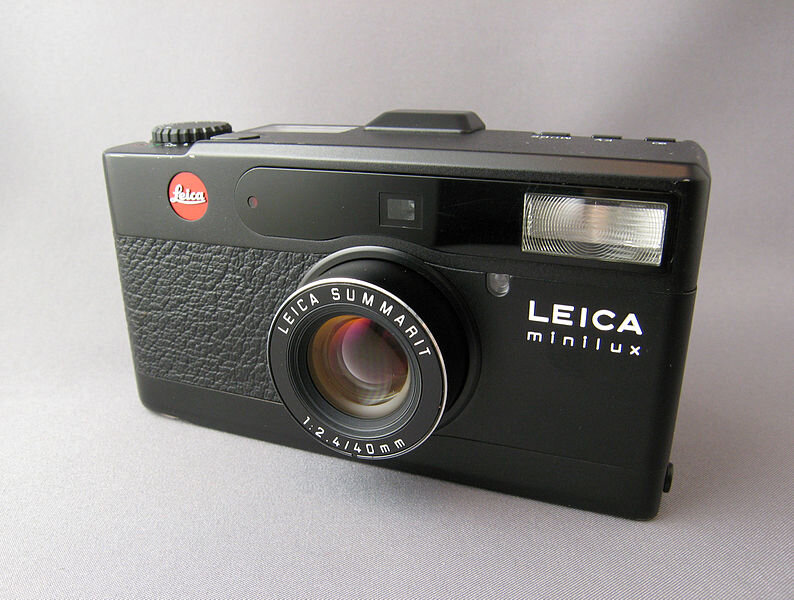 Leica Minilux. Most are champagne, but there are black variants available - but they’ll cost you.