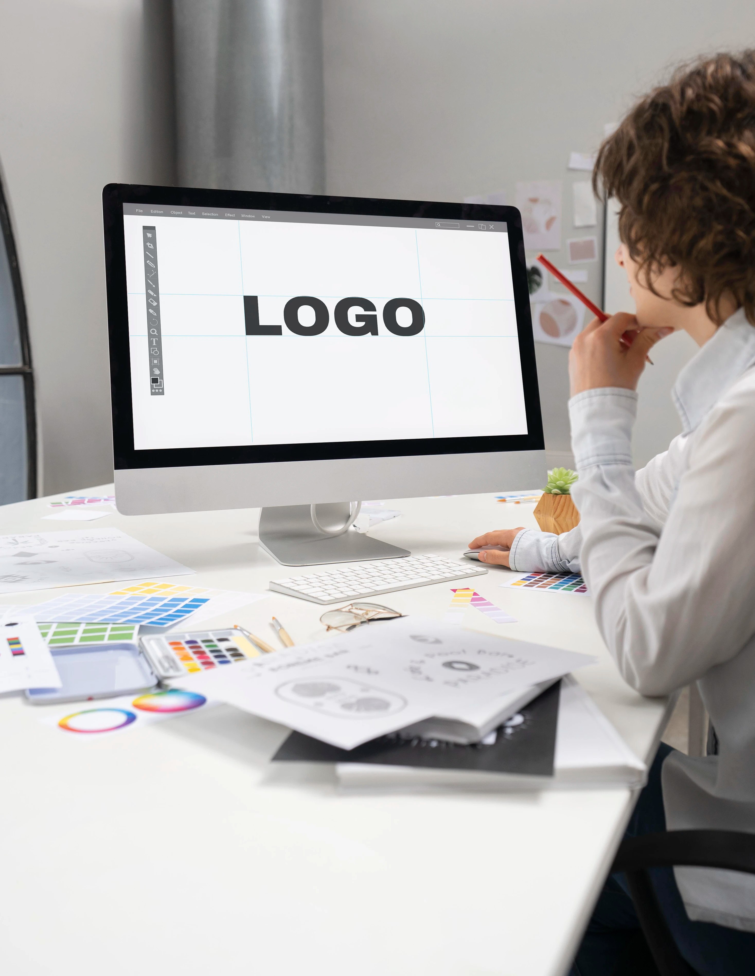 logo designer working computer desktop