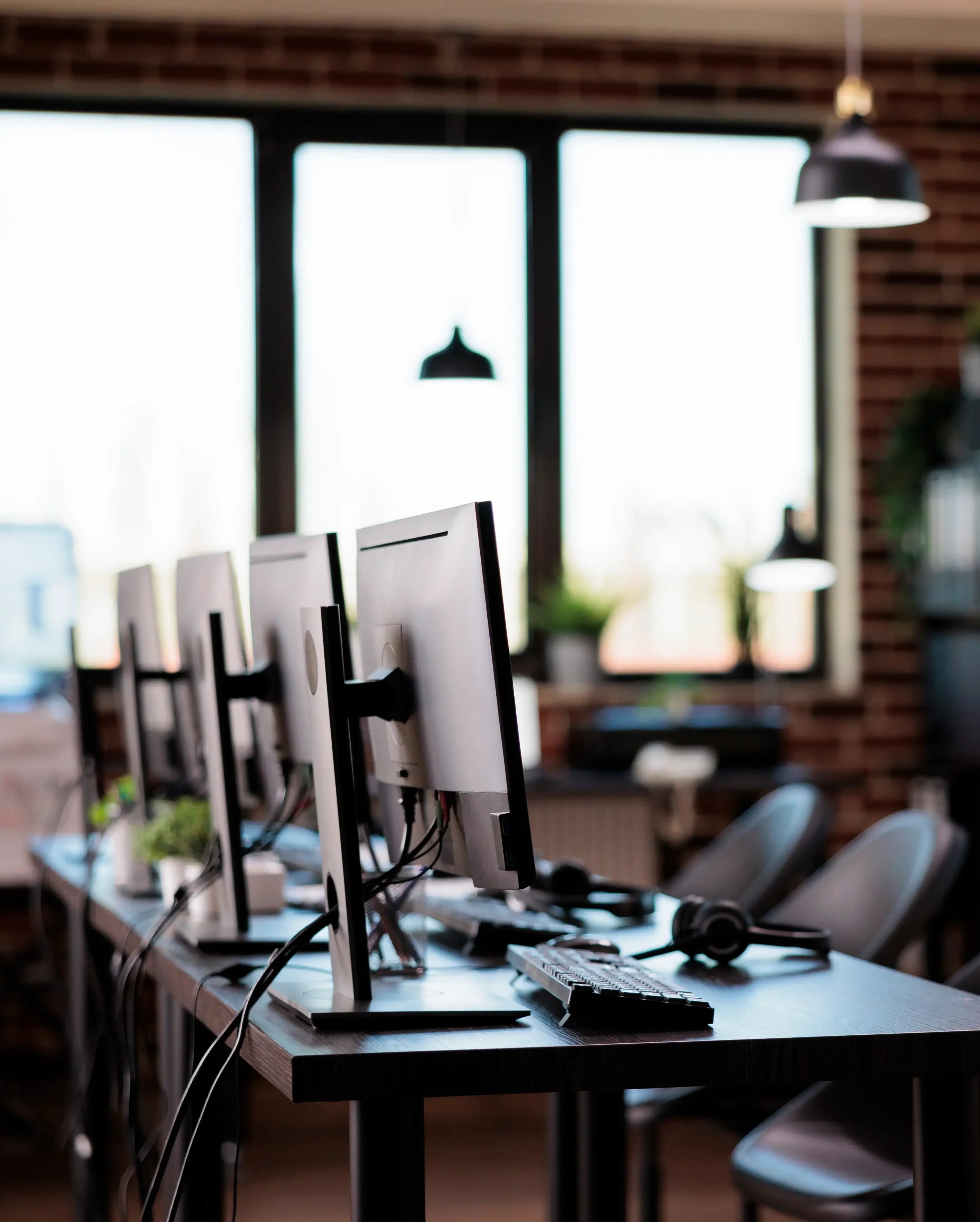 multiple computers customer service desk call-center helpline support give telecommunication assistance empty helpdesk with client telephony