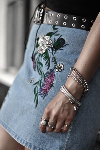Check out this cute outfit inspiration featuring this stylish embroidered denim skirt. The bustier makes the perfect combo for a fashionable daytime look.