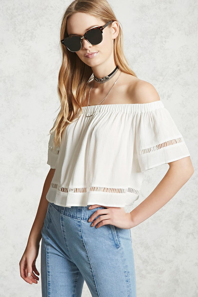 A cute off the shoulder crop top with ripped denim and sandals makes for the perfect casual style for a day in the city. I'm in love with this outfit!