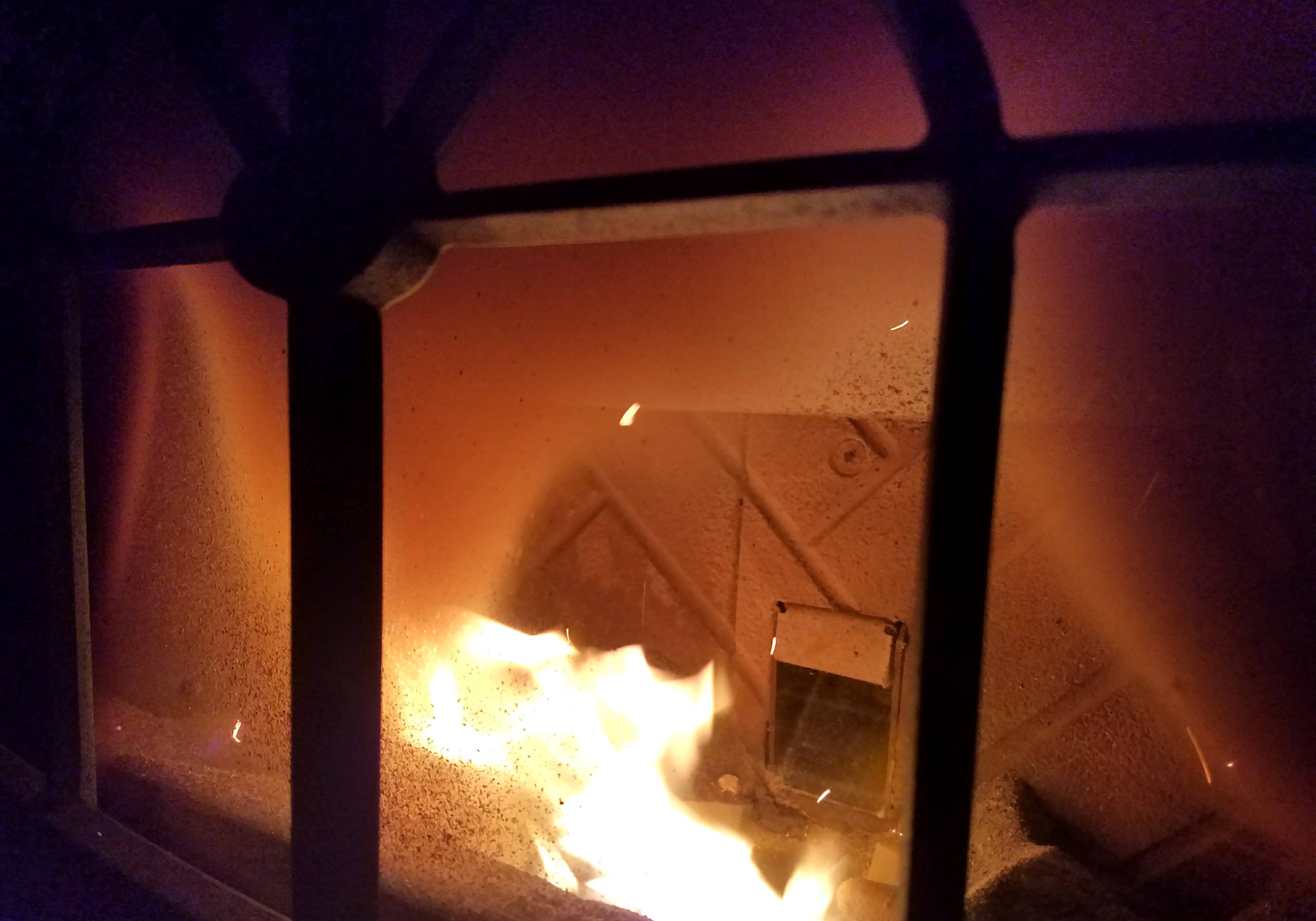 A boisterous forced air heating unit about the height of a human. Whitewashed radiators hot to the touch. Coils of heat embedded beneath floors that warm the soles of your feet. These are some of the heating systems I've had in the past. None are as prominent as the pellet stove, which cranks into action at regular intervals throughout the night as a fire ignites.