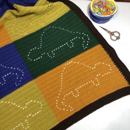 If you are on the hunt for dinosaur crochet pattern ideas, this is the post for you. Crochet Dinosaur Blanket Mayhem Majesty