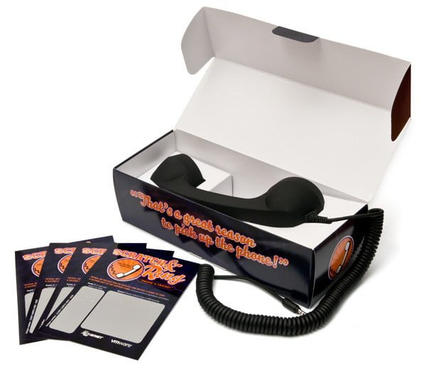 A group of professionals in formal attire gathers around a conference table in a modern office setting, engaging in a collaborative discussion. Laptops, documents, and a large screen displaying data are visible, indicating a business meeting or corporate strategy session. The room features large windows with natural light, creating a bright and productive atmosphere. The participants appear focused and engaged, reflecting teamwork and effective communication.