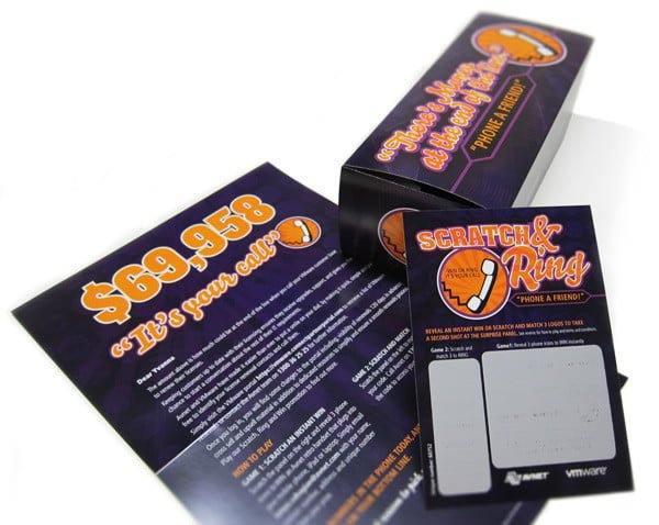 A modern office environment featuring a group of professionals collaborating around a large table with laptops and documents. The room is well-lit with natural light streaming through large windows, and there are multiple computer monitors displaying data and graphs. The team appears engaged in discussion, suggesting a brainstorming or project planning session. The office decor is minimalistic with clean lines and a professional atmosphere. This image conveys a sense of teamwork, productivity, and a tech-driven workplace.