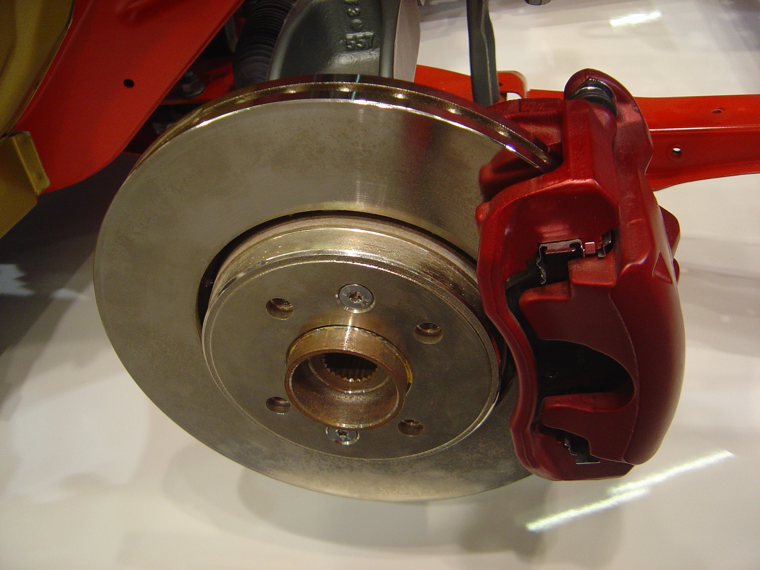 A disk brake component on a vehicle, showing the brake pad and rotor