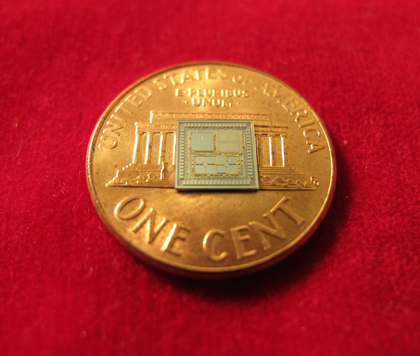 A DARPA prototype chip containing accelerometers and gyroscopes, smaller than a US penny