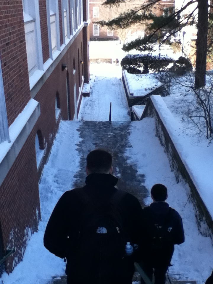 Students walk to class after campus is blanketed in snow. Photo by Michelle DePinho.