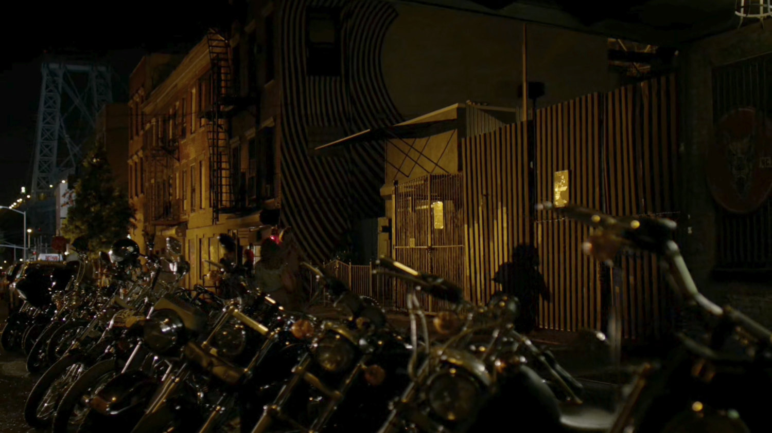 Motorcycles parked outside the Dogs of Hell bar.