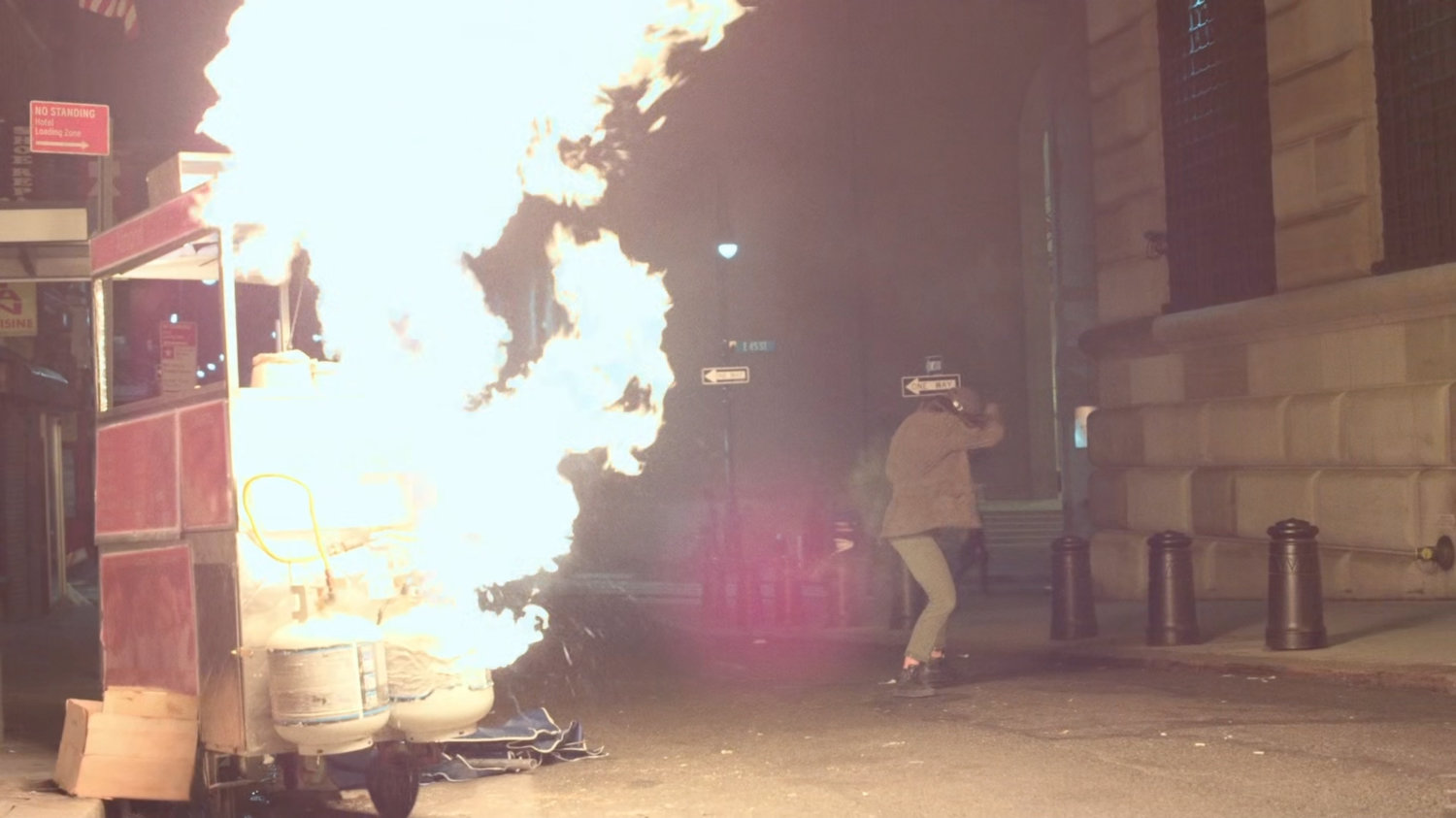 Claire flinching from an exploding peanut cart.