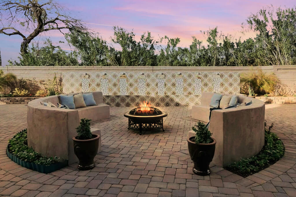 wide back yard with a bonfire and a cement chair