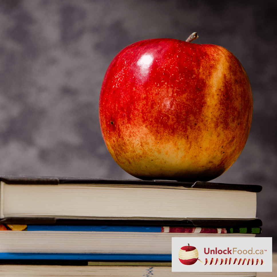 apple on a stack of books