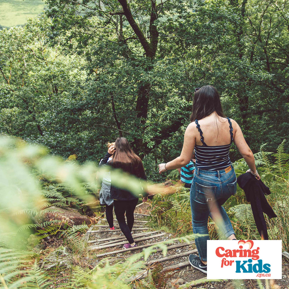 girls hiking in forest