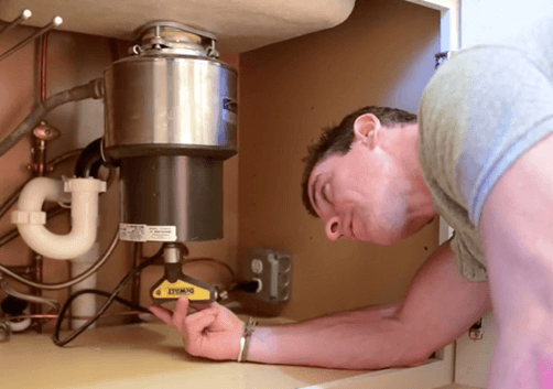 Video: How To Fix A Garbage Disposal