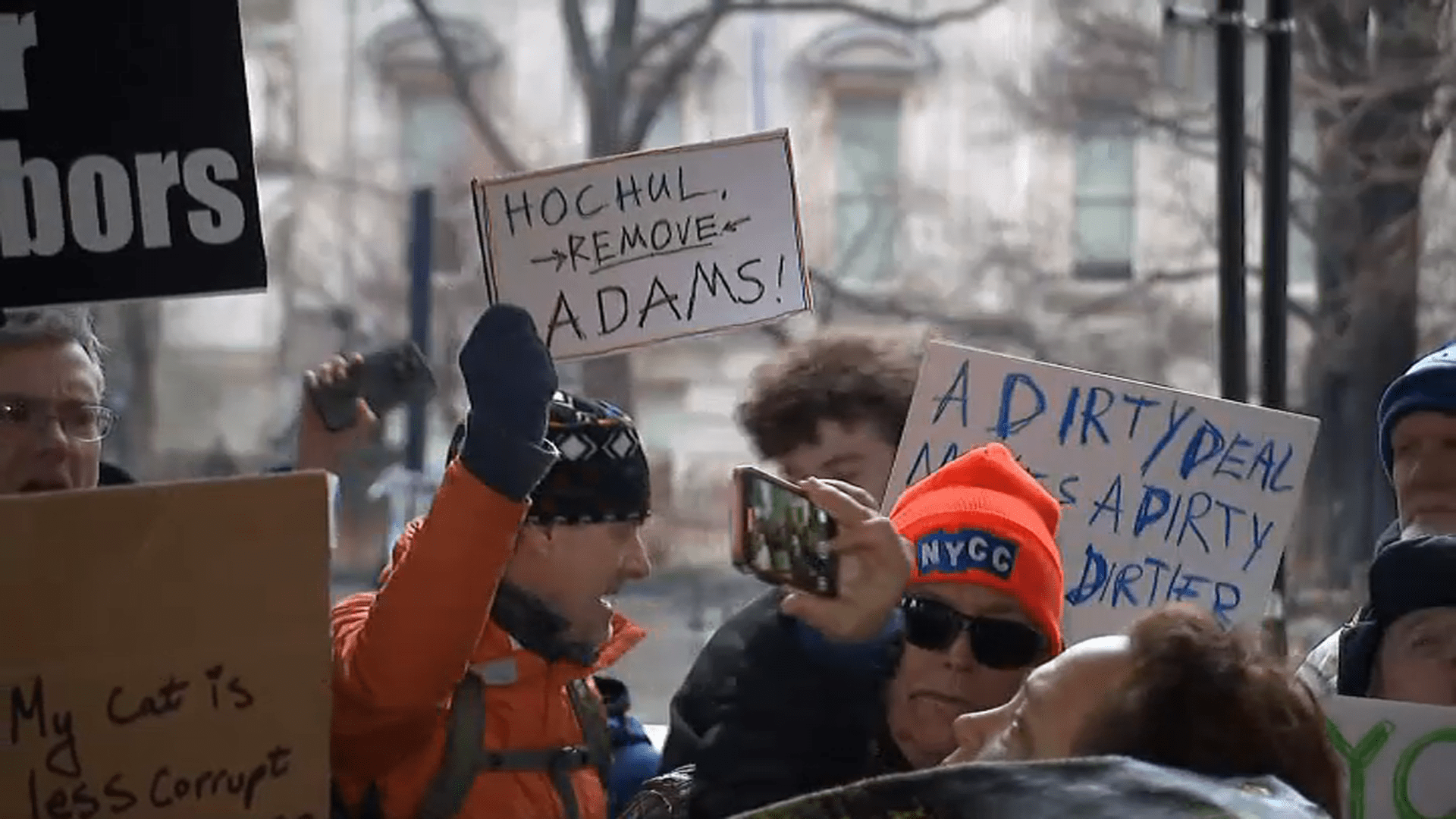 ‘Take away Eric Adams’: Protest calls on governor to take motion as mayor shrugs off controversy