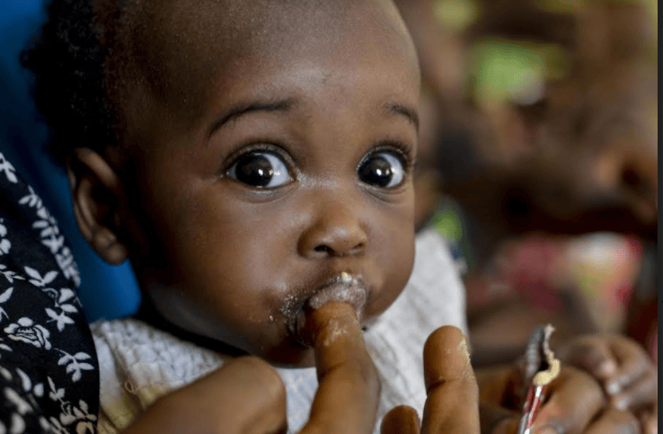 Photo of a child being fed Photo credit UNICEF