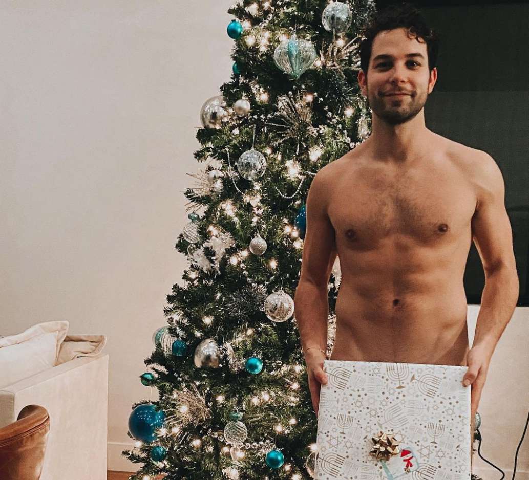 Skylar Astin Poses Nude Holding Only a Present for 'Happy Chanukah' Photo