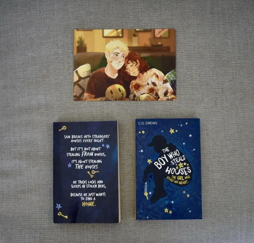 ARC and finished copy of The Boy Who Steals Houses with the art print of Sam and Moxie